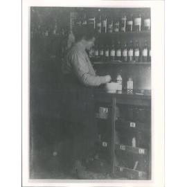 Mrs C. Sim in her father's pharmacy