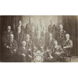 Group of men with shield, 'U.A.O.D. Royal Arch Chapter'