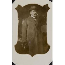 Man wearing overcoat and hat