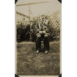 Man sitting in garden wearing druid regalia