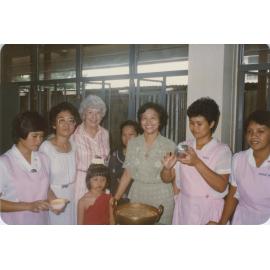 Professor Patricia Coleman with Asian women and children