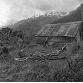 Man outside hut, Routeburn Track