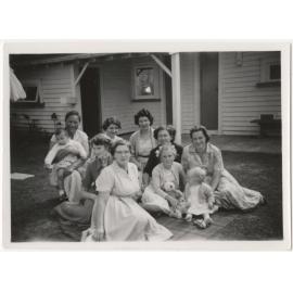 Mothers and babies in back garden, Bassam Hospital
