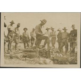 'Checking a few of the rifles and machine guns captured from Turks...'