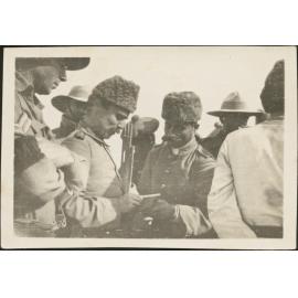 'Turkish officers captured at Magdhaba at [?] giving addresses and writing notes for transmission to Turks'