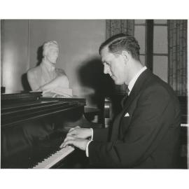 Maurice Till playing piano