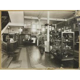 Brass instrument section and theatre box office, Bristol Piano Company, Princes Street, Dunedin