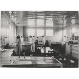 Six students working in kitchen