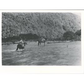 Men on horseback crossing Barrier River
