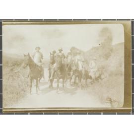 Men on horseback carrying milk cans