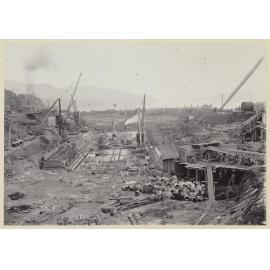 Construction site showing barrels and platforms