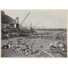 View of rail wagons, cranes and excavations