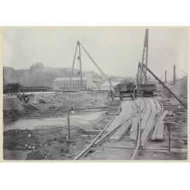 View of cranes, trucks and pulleys