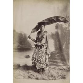 Unidentified young woman with banana frond