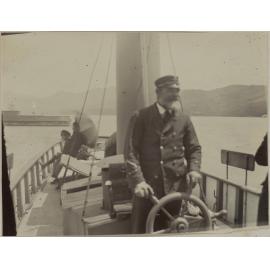 Captain Densen at the Helm