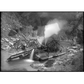 Sunken dredge being refloated