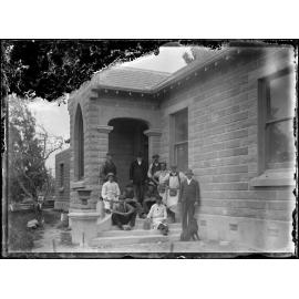 Men outside Oamaru stone building