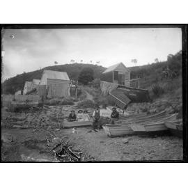 Fishermen with nets out to dry