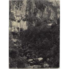 Road with cliff and stream below