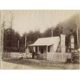 Family outside their home on the West Coast