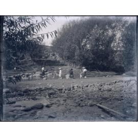 Family paddling in a river