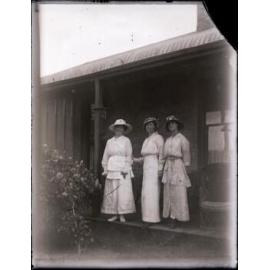 Three women on a porch