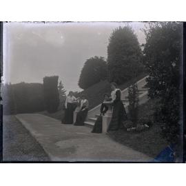 Four women in a formal garden
