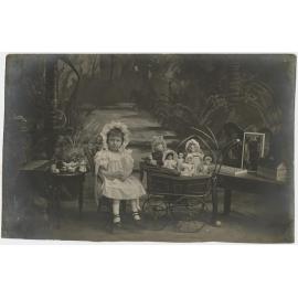 Elsie Annie Price with her dolls and tea party