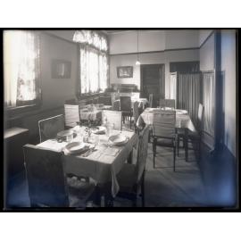 Tables with place settings at Studholme Hall, School of Home Science