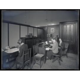 Office including students, desks, and typewriter, School of Home Science