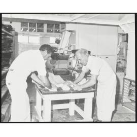 Two men kneading dough at Laurenson's Bakery