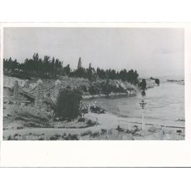 Bridge. Built 1876, washed away 1878, rebuilt (decking + cables only) 1881 after flood damage 1878, replaced 1935
