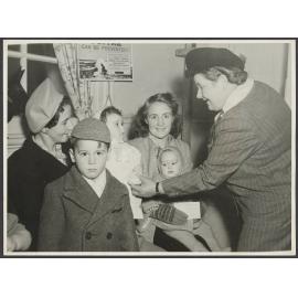 Mabel Howard meeting women and children [at a medical clinic]