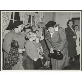 Mabel Howard meeting women and children [at a medical clinic]
