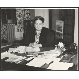Mabel Howard sitting at her desk