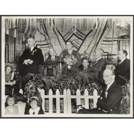 Ted and Mabel Howard on stage at an unidentified event