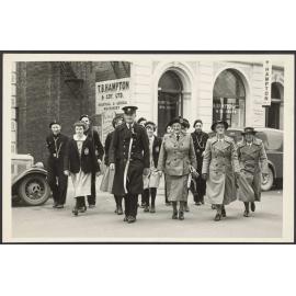 Group of people in Order of St John uniform crossing Moray Place
