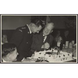 Mr Mulholland cutting a cake at a St John Ambulance Association event
