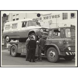 Ambulance on a Reilly's salvage truck outside Gardner Motors