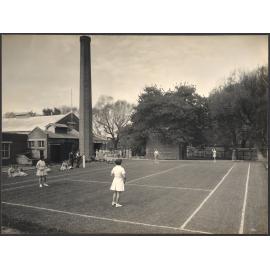 A Game of Tennis in Progress on Factory Court