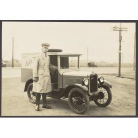 Man in uniform with Austin 7 light van