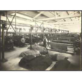 Interior view of large room with power weaving looms