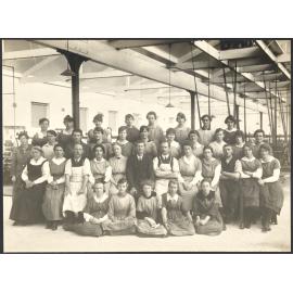 Staff group in front of machinery