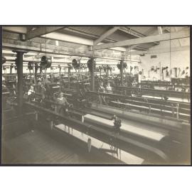 Interior with power weaving looms and workers