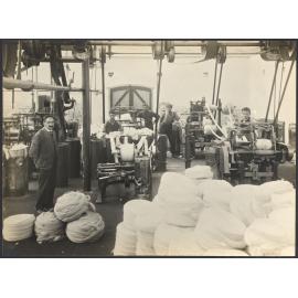 Workers with machines winding sliver or roving into large balls or 'bumps'