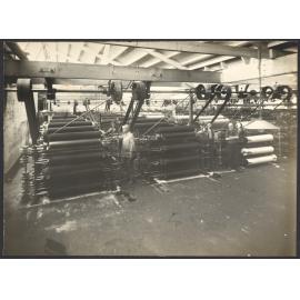 Workers with machines, probably part of spinning processes