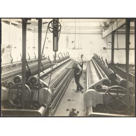 Workers with spinning machines or 'mules'
