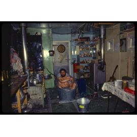 McKerrow bathing in mess hut