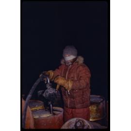 Lowe transferring fuel during winter