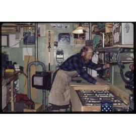 Harold Lowe making alteration in laboratory during winter